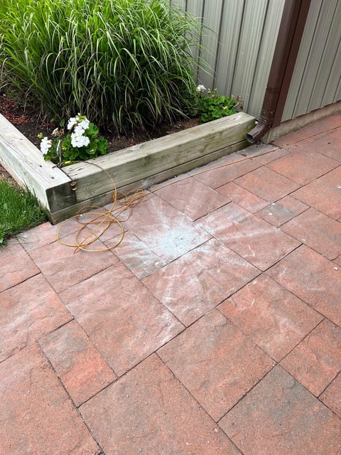 The meteorite that struck the front walkway of Joe Velaidum's home in Canada left a star-shaped pattern of debris on the pavement.