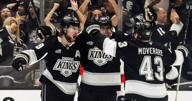 Kings winger Adrian Kempe, left, celebrates with teammates after scoring a go-ahead goal during the third period of their game against the Florida Panthers on Wednesday night at Crypto.com Arena. The Kings held on to win, 2-1. (AP Photo/Etienne Laurent)