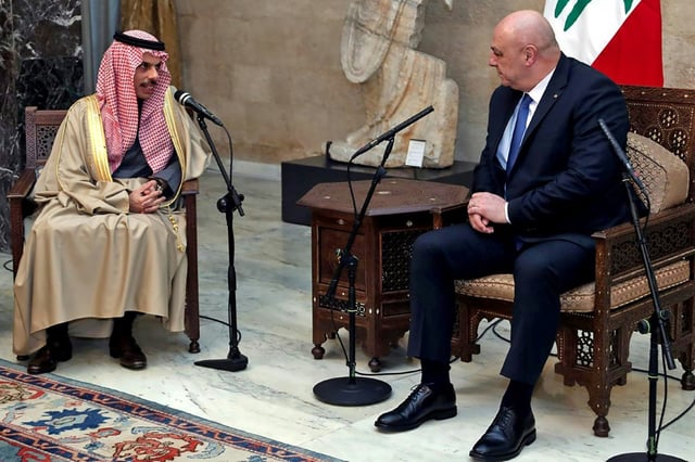 Lebanese President Joseph Aoun (R) speaks with visiting Saudi Arabian Foreign Minister Faisal bin Farhan on Thursday