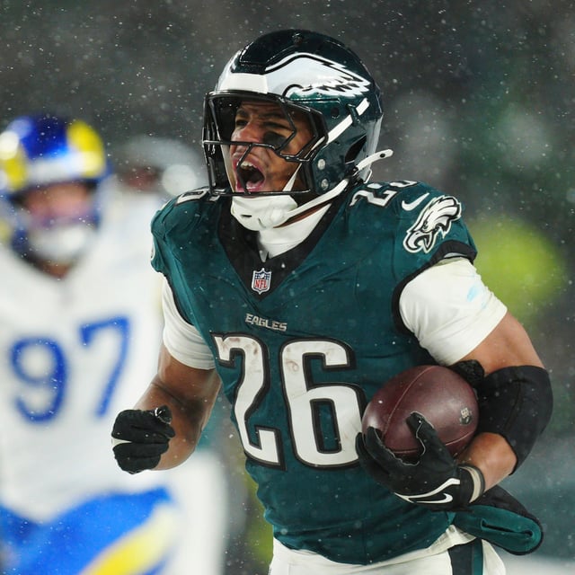 Philadelphia Eagles running back Saquon Barkley (26) runs the ball for a touchdown during the second half of an NFL football NFC divisional playoff game against the Los Angeles Rams on Sunday, Jan. 19, 2025, in Philadelphia. (AP Photo/Derik Hamilton)