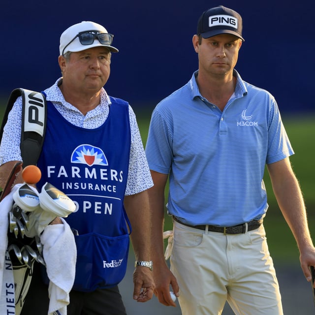 Harris English talks with his caddie while walking the 18th hole during the third round of the Farmers Insurance Open 2025 at Torrey Pines Golf Course on January 24, 2025 in La Jolla, California.