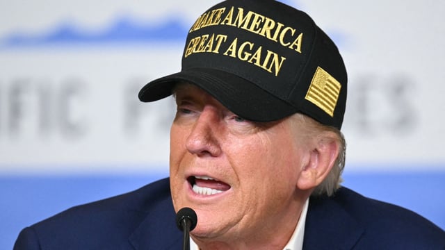 US President Donald Trump in a 'MAGA' cap (AP)