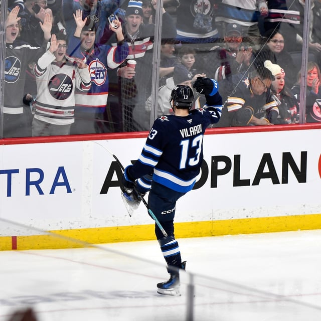 Winnipeg Jets' Gabriel Vilardi (13) celebrates his goal against the Calgary Flames during the third period of their NHL hockey game in Winnipeg, Sunday, Jan. 26, 2025. THE CANADIAN PRESS/Fred Greenslade