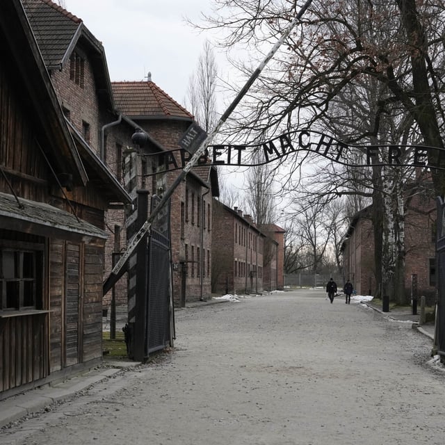 People visit the Memorial and Museum Auschwitz-Birkenau, a former Nazi German concentration and extermination camp, in Oswiecim, Poland, Sunday, Jan. 26, 2025.