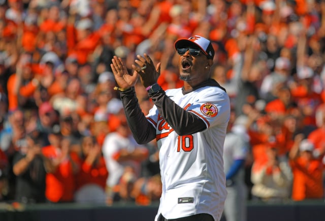 Former Oriole Adam Jones throws out the ceremonial first pitch before the Orioles vs. Rangers Game 1 of ALDS at Camden Yards.