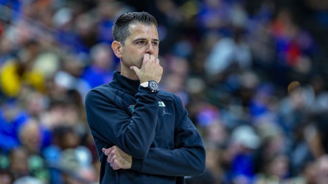 Florida coach Todd Golden watches play during a season-opening win against USF in Jacksonville. (Gary McCullough/AP)