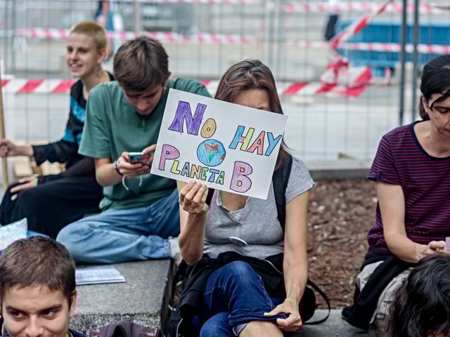 MADRID, SPAIN - SEPTEMBER 20: Several young people during a sit-in in front of the Congress of Deputies, on 20 September, 2024 in Madrid, Spain. Youth for Climate has called the protest under the slogan 'The Earth is not for sale' to ask the private sector and large companies to "cease their destructive activities" on the most vulnerable communities and peoples. (Photo By Ricardo Rubio/Europa Press via Getty Images)