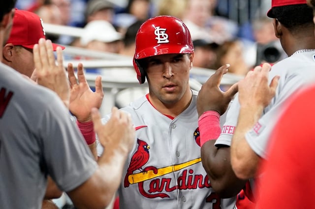 St. Louis Cardinals&#39; Dylan Carlson is congratulated in the dugout after scoring on a groundout by Paul Goldschmidt against the Miami Marlins during the fourth inning of a baseball game Wednesday, July 5, 2023, in Miami. (AP Photo/Lynne Sladky)