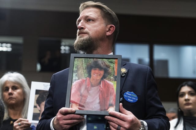 South Carolina state Rep. Brandon Guffey, holds a picture of his son Gavin Guffey, 17, who died by suicide after being entrapped in a sexual extortion scam on Instagram, during the Senate Judiciary Committee hearing titled "Big Tech and the Online Child Sexual Exploitation Crisis," in Dirksen building on Wednesday, Jan. 31, 2024. 