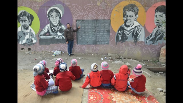NEW DELHI, INDIA - January 13: Children attend a class under a Delhi Metro bridge at the Free School Under the Bridge, a school that provides free-to-cost classes to children from low income areas during the cold weather at near Akshardham Temple, in New Delhi India onJanuary 13, 2025. (HT Photo) (Hindustan Times)