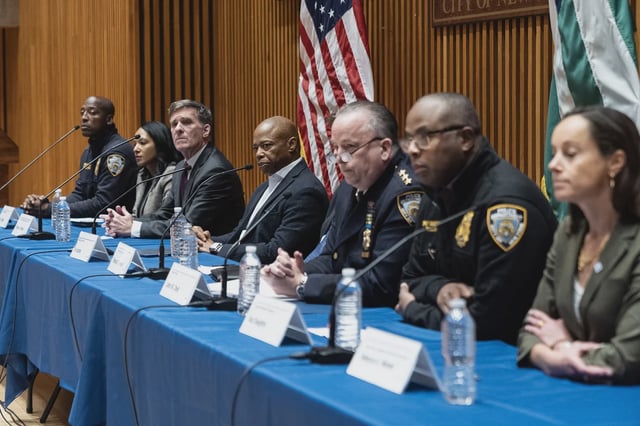 Mayor Eric Adams, center, and NYPD executives hold briefing in October, 2024.