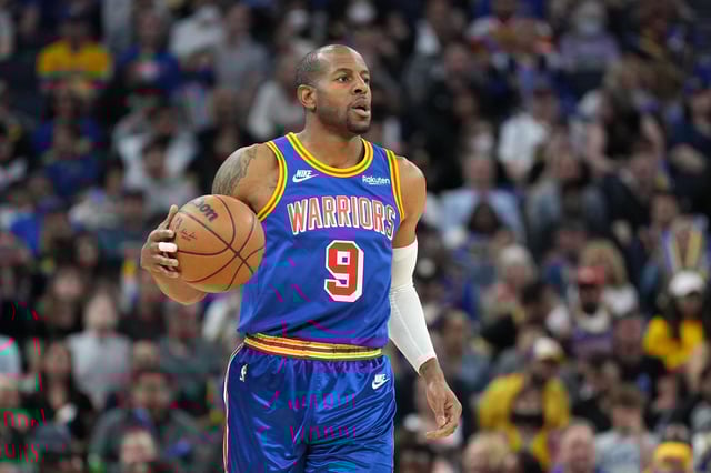 Golden State Warriors forward Andre Iguodala dribbles during the third quarter in a game against the Los Angeles Lakers in 2022.