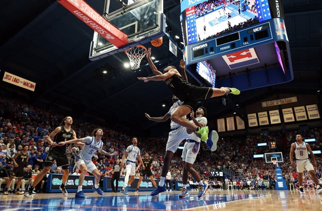 Keyshawn Hall, who had a game-high 34 points Tuesday night, extends for a basket on a drive past Kansas’ Flory Bidunga. (Jamie Squire/Getty)