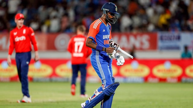 India's Hardik Pandya walks back to the pavillion after being dismissed by England's Jamie Overton during the 3rd T20I, at Niranjan Shah Stadium in Rajkot.
