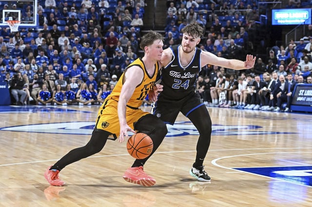 Virginia Commonwealth Rams guard Max Shulga tries to drive to the basket against Saint Louis Billikens guard Gibson Jimerson, who was the leading scorer in the game with 26.