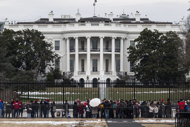 People gather outside the White House on January 18, 2025 in Washington, D.C.
