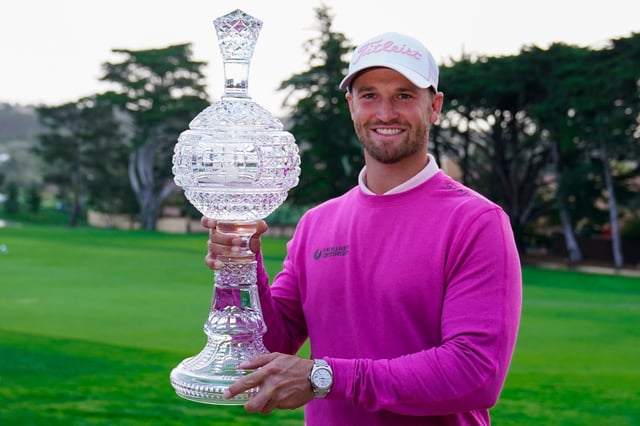 Wyndham Clark with the AT&T Pro-Am trophy during presentation for the 54-hole winner of the 2024 AT&T Pebble Beach Pro-Am golf tournament.