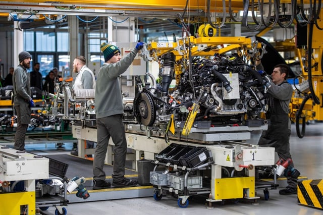 Caption: Employees work on an engine on the Bentley production line in Crewe.
Photo: Chris J. Ratcliffe/Bloomberg