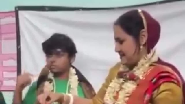 A teacher went viral for a staged wedding in her classroom with a student