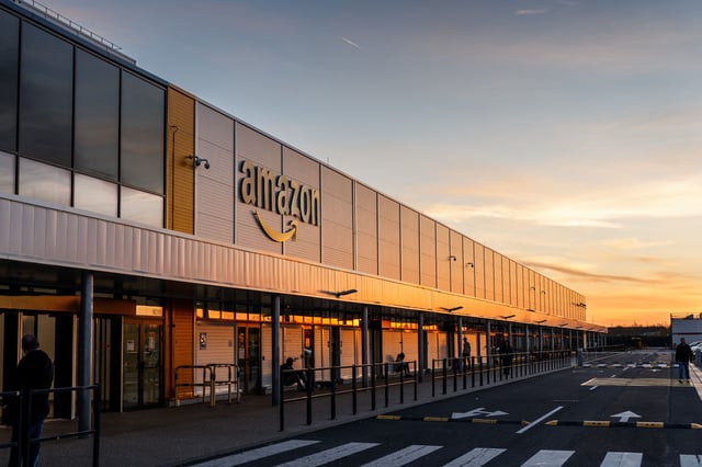 This photograph taken on November 22, 2023, shows the Amazon logo on the facade of Amazon's logistic site in Bretigny-sur-Orge, some 30 km south of Paris. (Photo by Dimitar DILKOFF / AFP) (Photo by DIMITAR DILKOFF/AFP via Getty Images)