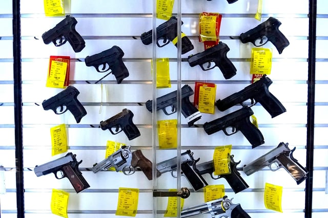 In this August 2024 photo, a selection of handguns are displayed a store in Maine.