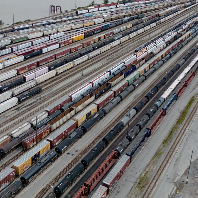 Train cars are seen in an aerial view as workers repair tracks at Canadian National Rail's Thornton Yard, in Surrey, B.C., on Thursday, August 22, 2024. THE CANADIAN PRESS/Darryl Dyck