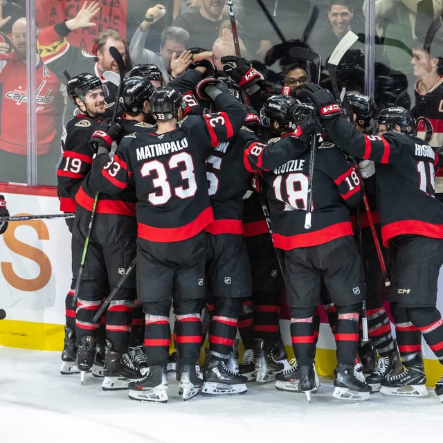 Jan 30, 2025; Ottawa, Ontario, CAN; The Ottawa Senators celebrate a goal scored in ovetime by defenseman Thomas Chabot (72) for their win  against the Washington Capitals at the Canadian Tire Centre. Mandatory Credit: Marc DesRosiers-Imagn Images