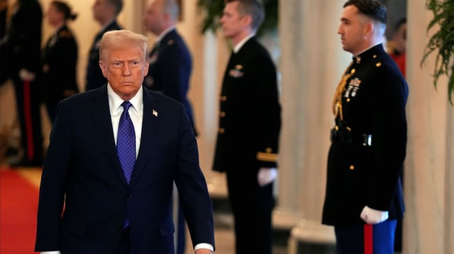 U.S. President Donald Trump walks down a corridor in the White House, in Washington, Jan. 29, 2025 (AP photo by Evan Vucci).