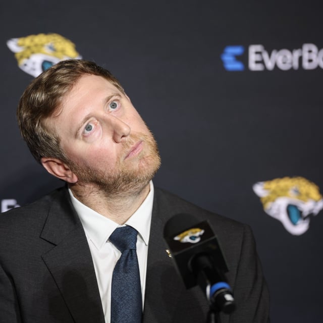 Liam Coen, new Head Coach of the Jacksonville Jaguars, reacts as he is introduced to the media at the Miller Electric Center on January 27, 2025 in Jacksonville, Florida.