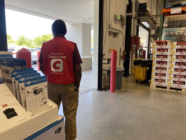 Costco employee Greeter at the entrance, checking for membership cards. Starting this year, hourly wages for non-union workers at the top of Costco’s pay scale will increase by $1 per hour, bringing their pay to $30.20. 