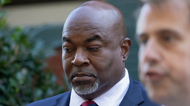 North Carolina Lt. Gov. Mark Robinson, left, the Republican nominee for governor, listens during a press conference on Tuesday, Oct. 15, 2024, in Raleigh, North Carolina. (Kaitlin McKeown/The News &amp; Observer/Tribune News Service via Getty Images)