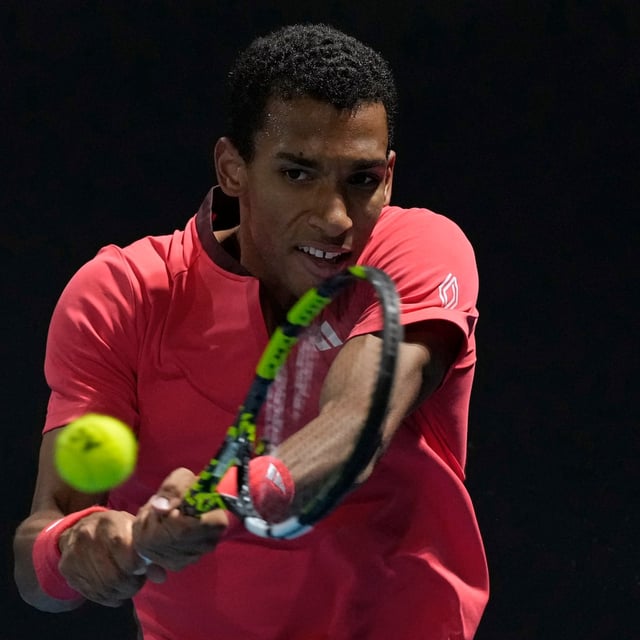 Felix Auger-Aliassime of Canada plays a backhand return to Alejandro Davidovich Fokina of Spain during their second round match at the Australian Open tennis championship in Melbourne, Australia, Wednesday, Jan. 15, 2025. THE CANADIAN PRESS/AP-Asanka Brendon Ratnayake
