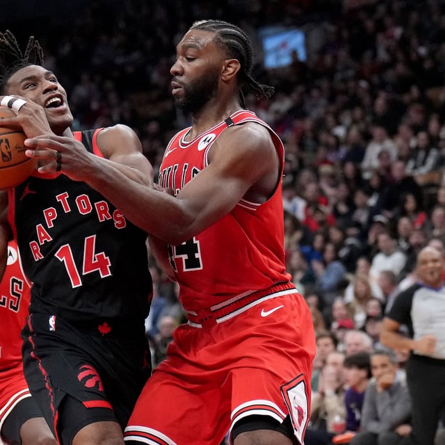 Toronto Raptors guard Ja'Kobe Walter (14) gets fouled by Chicago Bulls forward Patrick Williams (44) during second half NBA basketball action in Toronto, Friday, Jan. 31, 2025. THE CANADIAN PRESS/Nathan Denette