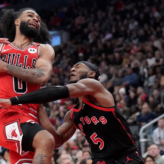 Toronto Raptors guard Immanuel Quickley (5) rejects Chicago Bulls guard Coby White (0) during first half NBA action in Toronto, Friday, Jan. 31, 2025. THE CANADIAN PRESS/Nathan Denette