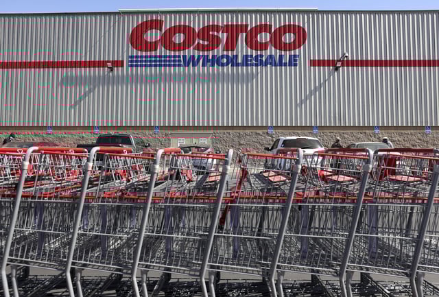 Shopping carts are lined up in front of a Costco store in Inglewood, California.