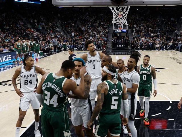 San Antonio's Jeremy Sochan restrained Giannis Antetokounmpo from going after Chris Paul.