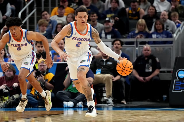 Riley Kugel #2 of the Florida Gators dribbles down court during the NCAA Men&#39;s Basketball Tournament - First Round game against the Colorado Buffaloes at Gainbridge Fieldhouse on March 22, 2024 in Indianapolis, Indiana.