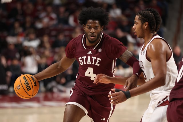 Cameron Matthews #4 of the Mississippi State Bulldogs dribbles against Collin Murray-Boyles #30 of the South Carolina Gamecocks at Colonial Life Arena on January 25, 2025 in Columbia, South Carolina.