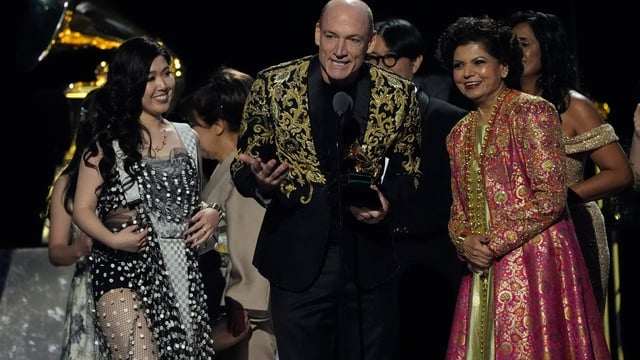 (L-R) Eru Matsumoto, Wouter Kellerman, and Chandrika Tandon accept the award for best new age, ambient, or chant album for Triveni during the 67th annual Grammy Awards on Sunday.
