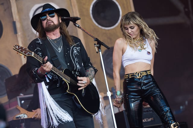 Billy Ray Cyrus and Miley Cyrus perform on the Pyramid stage on day five of Glastonbury Festival at Worthy Farm, Pilton on June 30, 2019 in Glastonbury, England.