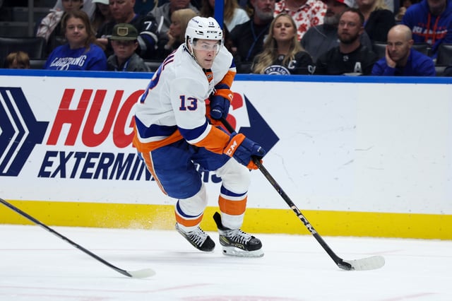 Feb 1, 2025; Tampa, Florida, USA; New York Islanders center Mathew Barzal (13) controls the puck against the Tampa Bay Lightning in the third period at Amalie Arena. Mandatory Credit: Nathan Ray Seebeck-Imagn Images/File Photo