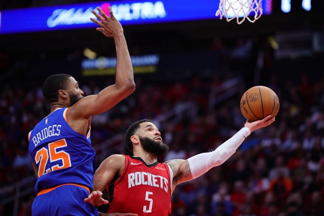 Fred VanVleet #5 of the Houston Rockets shoots against Mikal Bridges #25 of the New York Knicks during the second half at Toyota Center on November 04, 2024 in Houston, Texas.