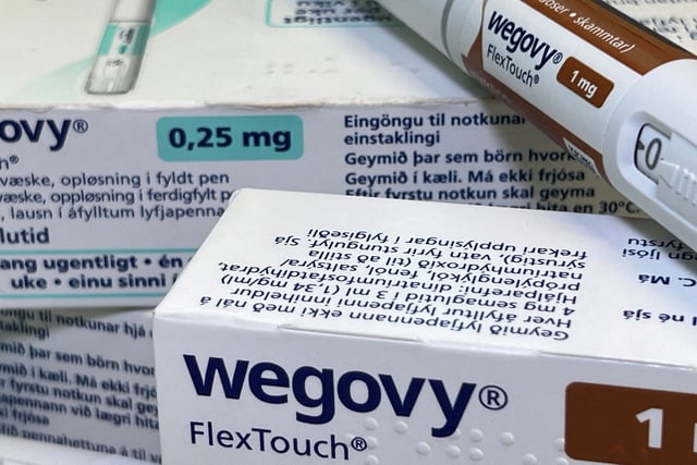 Injection pens and boxes of Novo Nordisk's weight-loss drug Wegovy are shown in this photo illustration in Oslo, Norway, November 21, 2023. REUTERS/Victoria Klesty/Illustration/File Photo