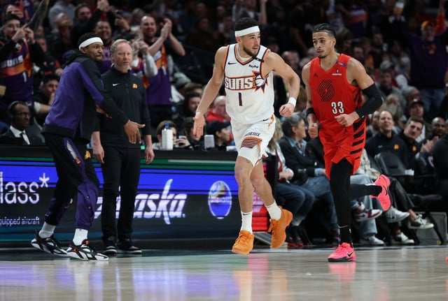Feb 3, 2025; Portland, Oregon, USA; Phoenix Suns guard Devin Booker (1) reacts after scoring against the Portland Trail Blazers to make Booker the SunsÕ all-time leading scorer in the second half at Moda Center. Mandatory Credit: Jaime Valdez-Imagn Images