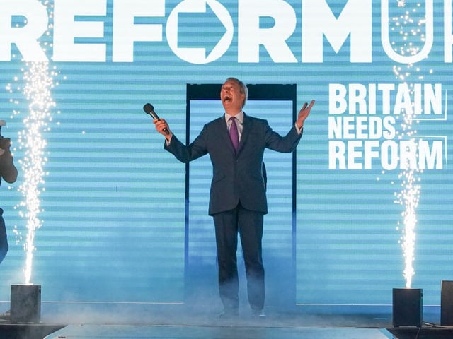 HOUGHTON LE SPRING, ENGLAND - FEBRUARY 01: Reform UK leader Nigel Farage MP speaks on stage during the Reform UK County Durham Conference at the Sunderland Live Venue on February 01, 2025 in Houghton le Spring, England. Reform UK is holding a series of rallies across the UK. This week's comes after a Reform fundraiser held earlier this week at Oswald's private member's club in Mayfair, London, where leader Nigel Farage gave a keynote address to donors, who reportedly paid £10,000 to £25,000 per ticket. (Photo by Ian Forsyth/Getty Images)