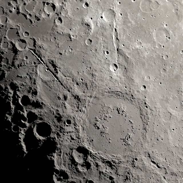 Two grand canyons on the moon radiating from the Schroedinger impact basin near the lunar south pole on the lunar far side are seen in this undated image using data obtained by NASA's robotic Lunar Reconnaissance Orbiter spacecraft.  NASA/SVS/Ernie T. Wright/Handout via REUTERS
