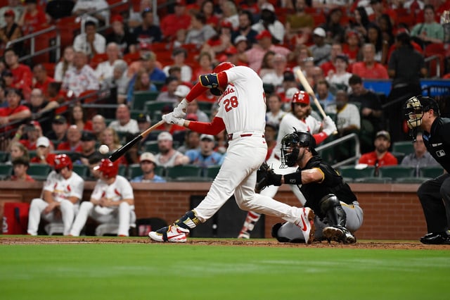 ST LOUIS, MISSOURI - SEPTEMBER 18: Nolan Arenado #28 of the St. Louis Cardinals hits an RBI single against the Pittsburgh Pirates during the third inning at Busch Stadium on September 18, 2024 in St Louis, Missouri.