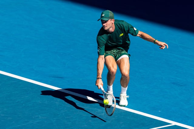Jan 21, 2025; Melbourne, Victoria, Australia; Tommy Paul of United States of America plays a backhand during his match against Alexander Zverev of Germany in the quarterfinals of the men's singles at the 2025 Australian Open at Melbourne Park. Mandatory Credit: Mike Frey-Imagn Images/File Photo
