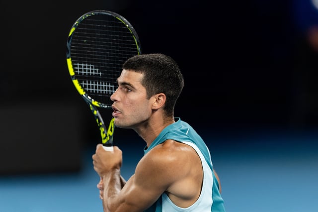 Jan 21, 2025; Melbourne, Victoria, Australia; Carlos Alcaraz of Spain in action during his match against Novak Djokovic of Serbia in the quarterfinals of the men's singles at the 2025 Australian Open at Melbourne Park. Mandatory Credit: Mike Frey-Imagn Images/File Photo