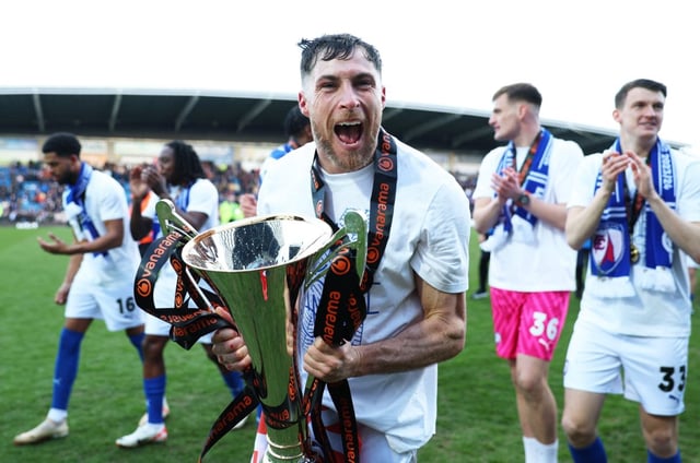 Mike Jones of Chesterfield celebrates with the National League trophy (Photo: Getty)